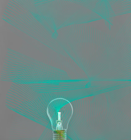 Turned off lightbulb on green background with hologram. The concept of energy saving or environmental protection. Close-upの写真素材