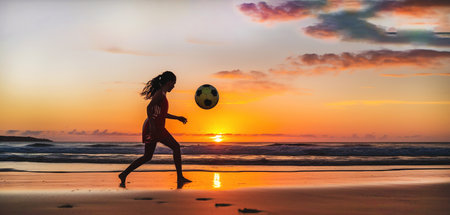 Active summer sport near the sea, beach soccer at sunset. Close-up. Generative Ai content.の素材