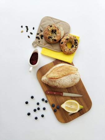 Bread with raisins and blueberries on a wooden board