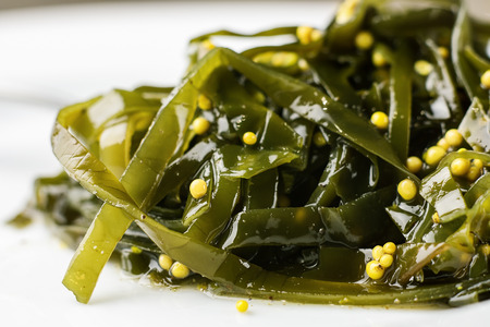Seaweed salad with mustard seeds, close-up.の写真素材
