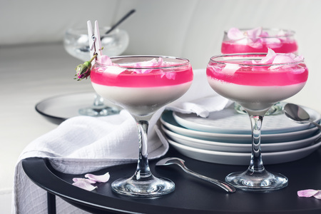 Vanilla panna cotta dessert with rose petals.の写真素材