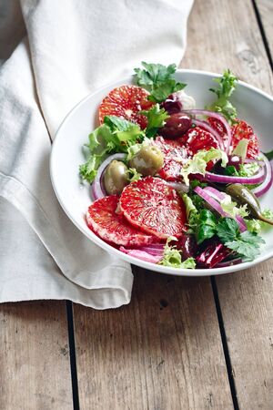 Sicilian orange salad. Salad with blood orange, red onions and olives.の写真素材