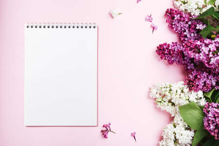 Notebook sheet, purple and white lilacs on a pink background.