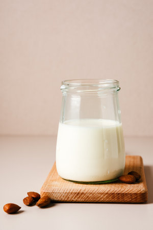 Jar of almond milk with nuts. Vegan milk.