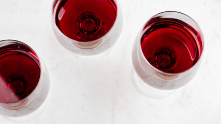 Red wine on white marble background.の写真素材