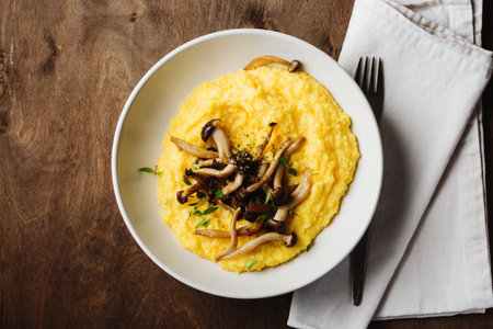 Creamy polenta with roasted shimeji mushrooms, top view.の写真素材
