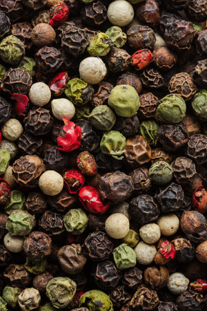 Peppercorns close-up, pepper mix, food background.の写真素材