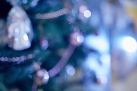 Christmas tree decorated violet close up unfocused