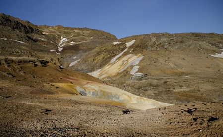 Iceland is a land of ice and fire. In the geothermal area Kerlingarfjoll one can see smoke and boiling fumaroles from the geothermal field as well as mountains covered by ice and snow.の写真素材