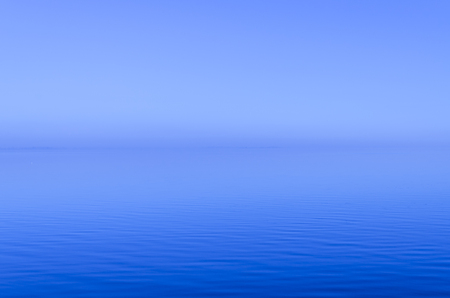 Blue Misty sunset over the River with horizonの写真素材