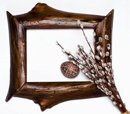 Easter Pussy-willow and Easter egg on wooden background. Happy Easter card. with Happy Easter. rustic lacquered Blank picture poster frame template isolated on white backgroundの写真素材
