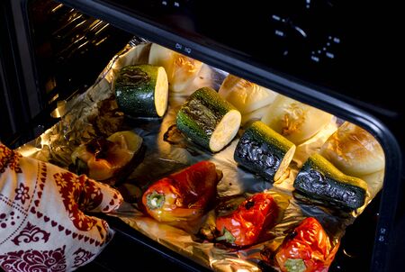 Healthy food. Pepper and zucchini with a ruddy crust are prepared in the oven. Close-up. Grilled vegetablesの写真素材