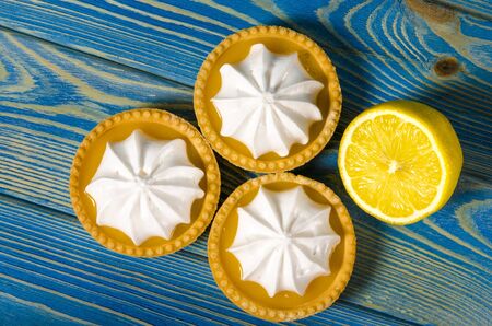 Lemon Meringue Pie. Small Lemon Meringue Pie Dessert Shortcrust Pastry with Lemon Custard Filling and Fluffy Meringue Topping Isolated on a white background. Selective focus.の写真素材