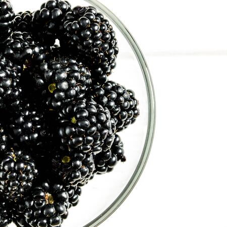 Large juicy black blackberry berries close-up with copy space top viewの写真素材