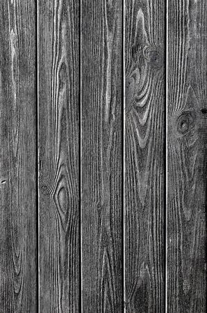 Dark wood background from old planks. texture of a wooden board of solid woodの写真素材