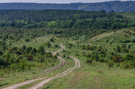 Wild mountain dirt roads for SUVs lead high into the mountains. roadsの写真素材