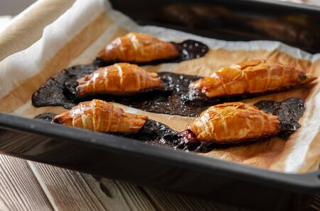 Failed attempt to bake croissants with berry filling. Kitchen. Dessertの写真素材