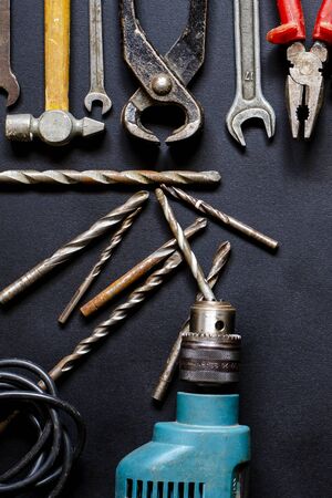 Hand tools for repair and reconstruction in home conditions lie on a black background. copy spaceの素材 [FY310144597820]