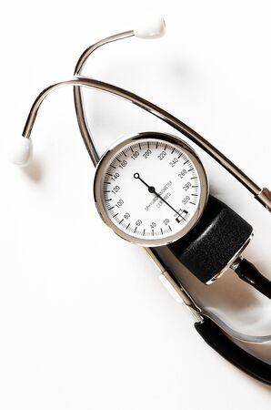 Concept for medicine. Vintage tonometer and stethoscope on white isolated background. View from aboveの素材 [FY310143301969]