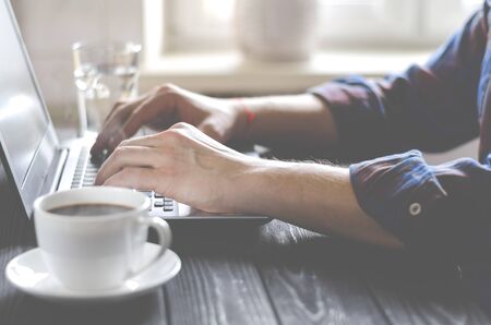 Minimal Freelancer workplace concept top view. Open laptop with blank screen on a white background top viewの写真素材