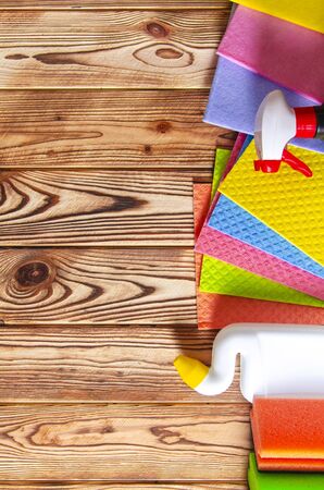 Colorful cleaning set for different surfaces in kitchen, bathroom and other rooms. Cleaning service concept. Top viewの写真素材