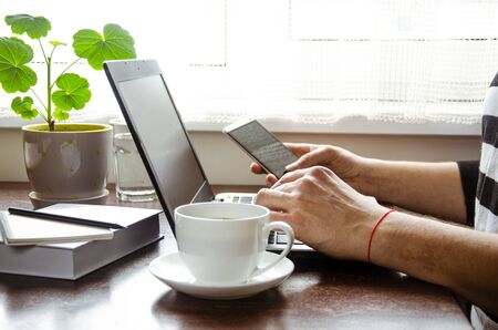 Freelancer works on a laptop in the home office. Business work on laptop