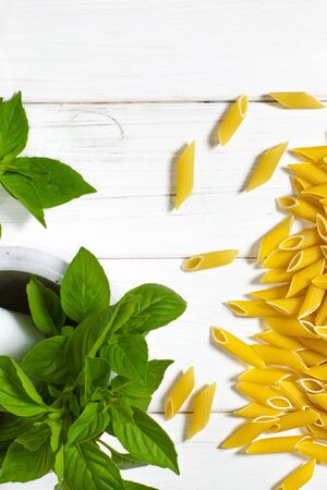 Cooking vegetarian penne pasta from organic products. Top viewの写真素材