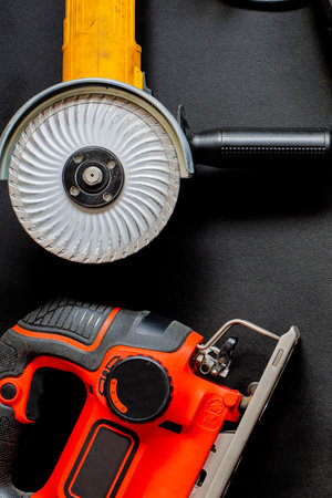 A remonic set of tools. Electrical tools for repair in the house and office. An electric tool for repair, construction and business lies on a black background. Close-upの写真素材