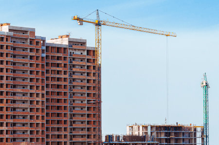 Tower cranes and modern buildings under construction