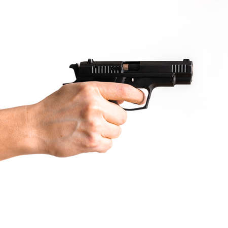 Pistol, or Auto-Loader Short gun in female's hand preparing or self loading prompt to use. Man holding gun aiming pistol in hand ready to shoot. The criminal robber or gangster thief conceptの写真素材