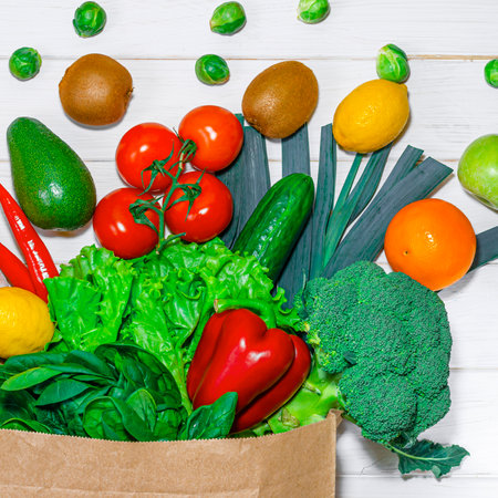 Paper bag with different groceries on white backgroundの写真素材