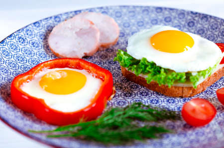 traditional breakfast of scrambled eggs and sandwichesの写真素材