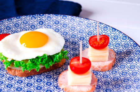 good morning. traditional breakfast of scrambled eggs and sandwichesの写真素材