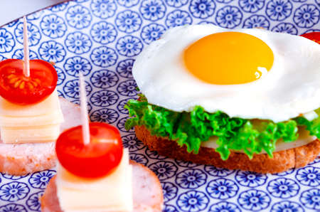 good morning. traditional breakfast of scrambled eggs and sandwichesの写真素材
