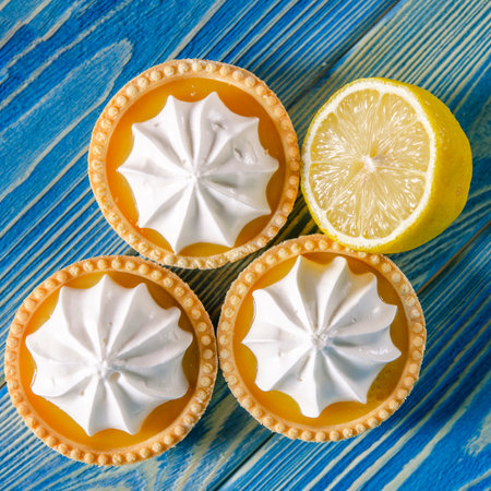 Sweet dessert for tea or coffee. Lemon cakes on a blue wooden tableの写真素材
