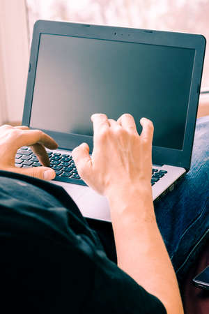 Concept of distance learning, isolation, business, shopping online. Close up of man handsの写真素材