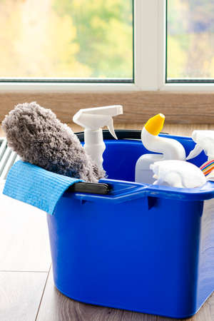 Cleaning service. Bucket with sponges, chemicals bottles and mopping stick. Rubber gloves and towel....