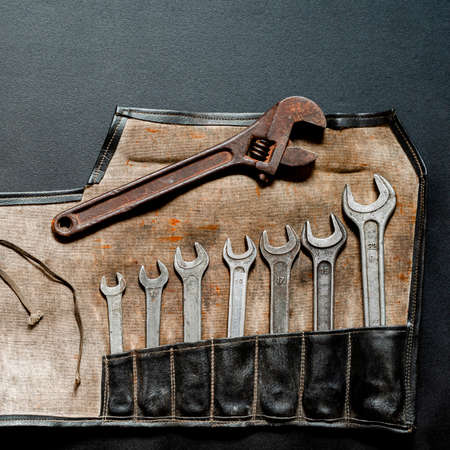 Vintage old tools on stone backdrop. Top view with copy spaceの写真素材