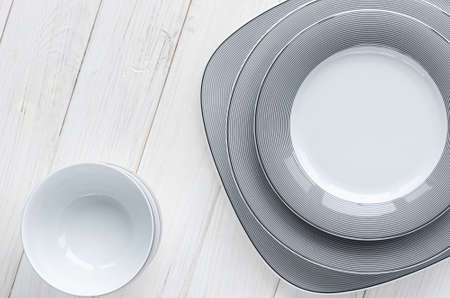 A classic set of porcelain plates of different shapes and sizes. For home and restaurantの写真素材