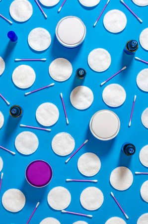 Cosmetic content. Top view. Flat lay composition with cosmetic products on color backgroundの写真素材