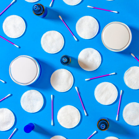 Cosmetic content. Top view. Flat lay composition with cosmetic products on color backgroundの写真素材