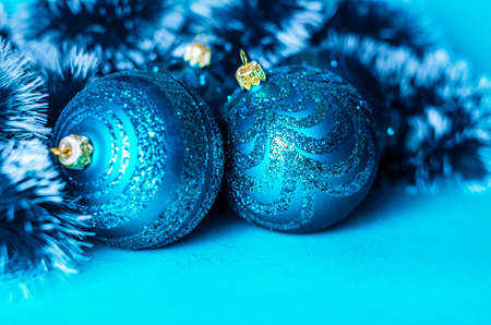 Christmas composition with blue decorations, confetti on blue background with copy space. Top view, Flat layの写真素材