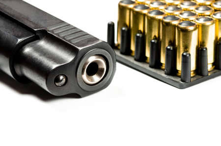 Gun parts of automatic hand gun with 9 mm bullets on a white background. Weaponsの写真素材