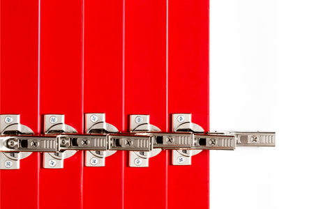 The red facades for the chest of drawers with metal loops lie on a white background. Assembly and installation of furniture. Businessの写真素材