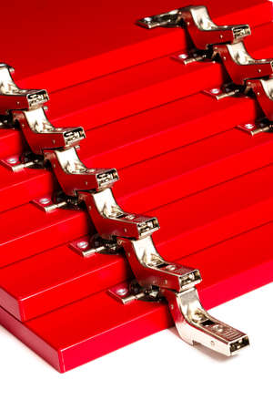The red facades for the chest of drawers with metal loops lie on a white background. Assembly and installation of furniture. Businessの写真素材