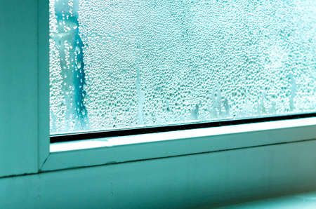Ecology problems. Condensation and black mold on white plastic windows. Plastic. Ecologyの写真素材
