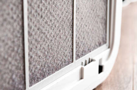 HEPA filter for air purification in the apartment and office is covered with a layer of dust. Purity. ecology. Clean airの写真素材