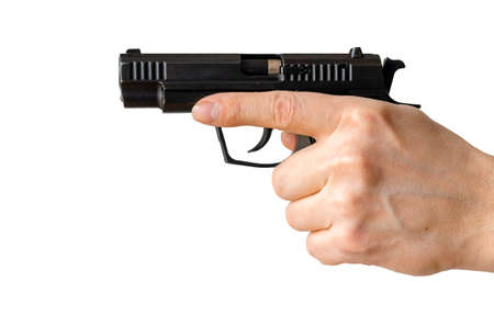 Man holding gun aiming pistol in hand ready to shoot. The criminal robber or gangster thief conceptの写真素材