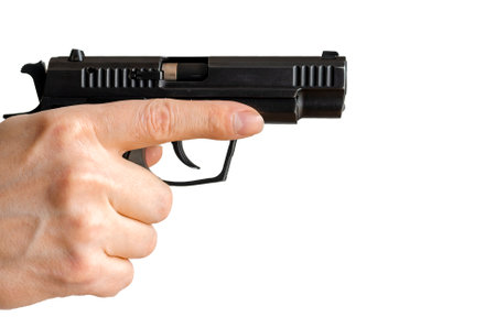 Man holding gun aiming pistol in hand ready to shoot. The criminal robber or gangster thief conceptの写真素材