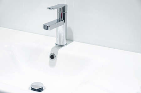 Mixer cold hot water. modern bathroom faucet. Kitchen tap. Isolated white background. Chrome plated metal.の写真素材